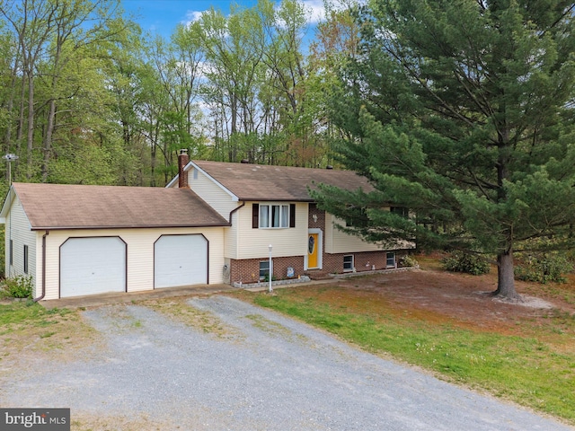 view of front of property with a chimney, a garage, driveway, and roof with shingles