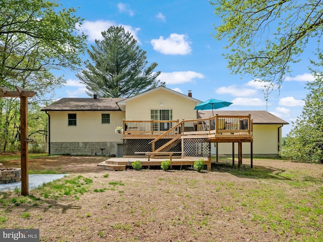 back of property with a wooden deck