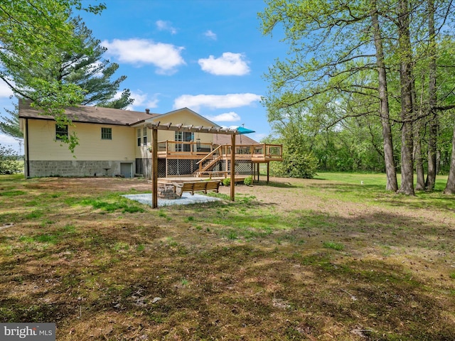 view of yard featuring a wooden deck and stairway