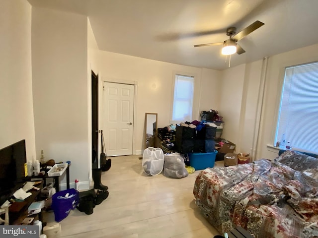 bedroom with a ceiling fan and wood finished floors