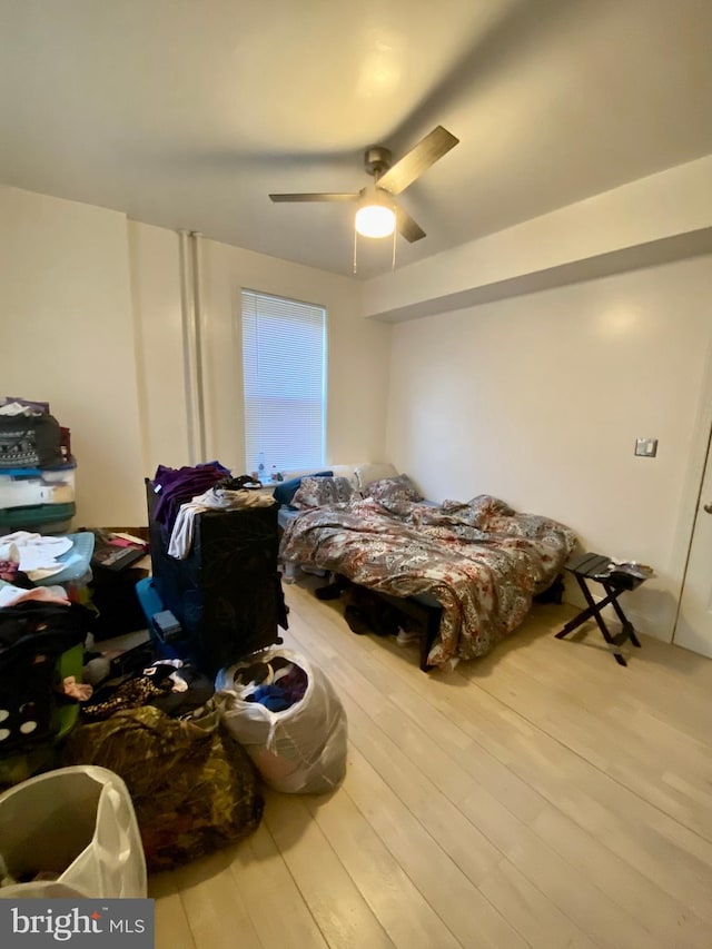 bedroom featuring wood finished floors and a ceiling fan