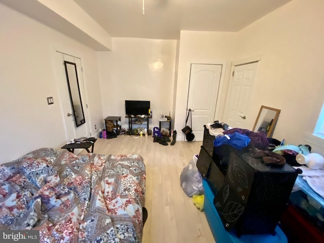 bedroom with wood finished floors