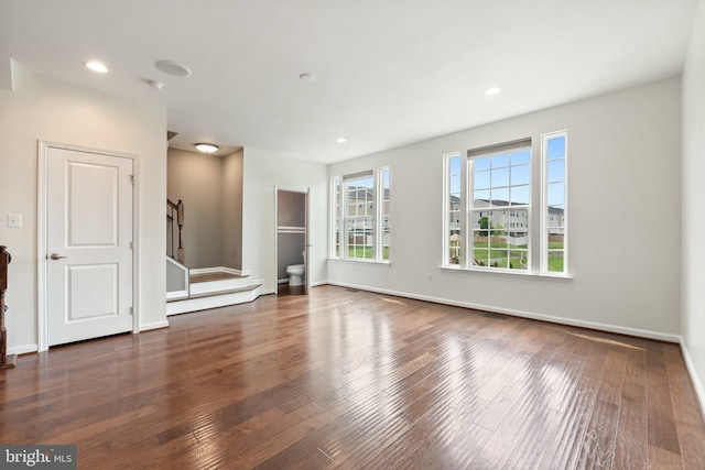 172 Trout Lily Dr, Lake Frederick, VA 22630 - unfurnished living room with wood-type flooring, stairway, baseboards, and recessed lighting