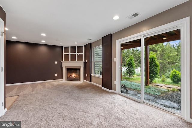 172 Trout Lily Dr, Lake Frederick, VA 22630 - unfurnished living room featuring carpet, baseboards, recessed lighting, and a fireplace with flush hearth