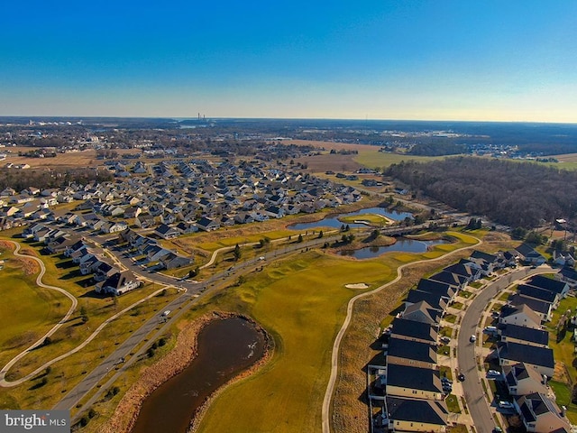 aerial view with a residential view, view of golf course, and a water view