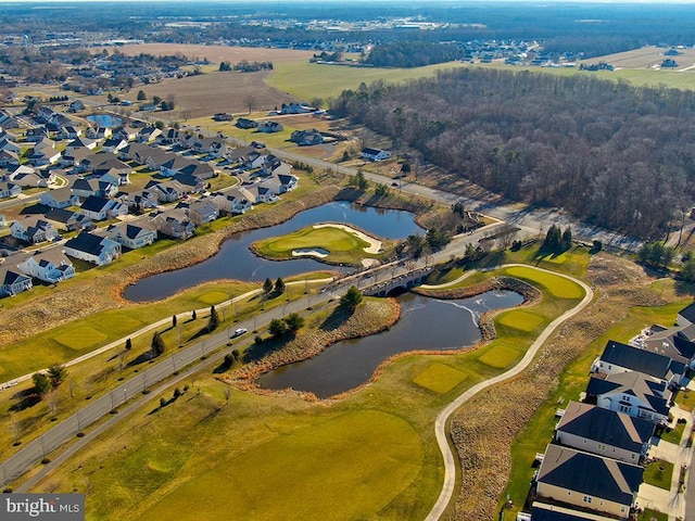 drone / aerial view with a water view, a residential view, and golf course view
