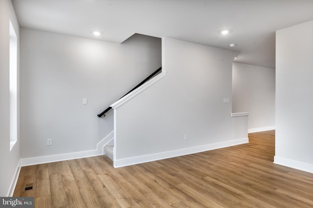 interior space with recessed lighting, light wood-style floors, stairway, and baseboards