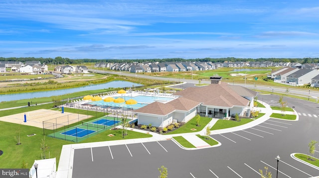 aerial view with a water view and a residential view