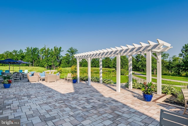 view of patio featuring an outdoor living space and a pergola