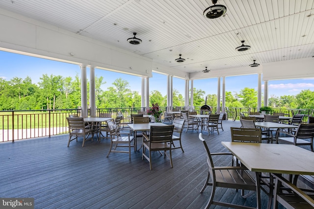 wooden terrace with outdoor dining space