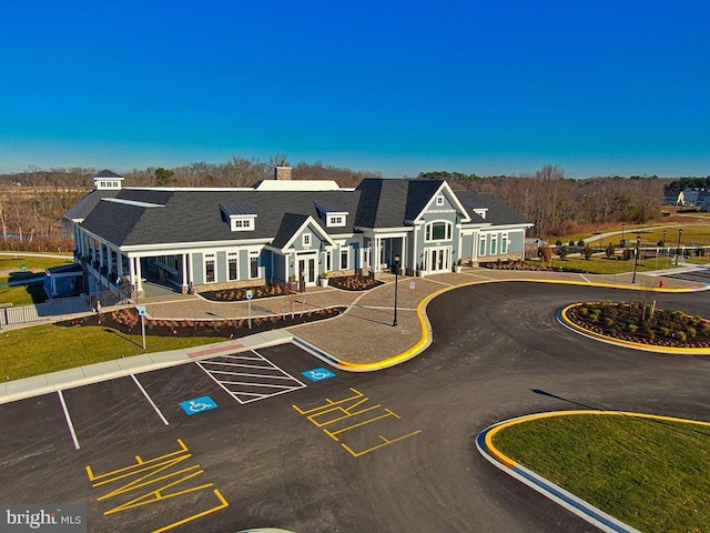 view of property with uncovered parking