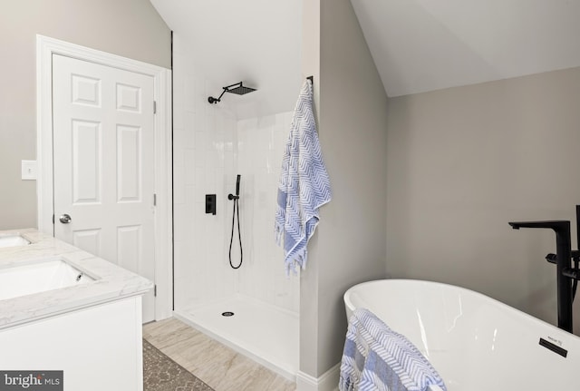 425 N Broadway, Pitman, NJ 08071 - bathroom with vaulted ceiling, a soaking tub, a tile shower, and double vanity