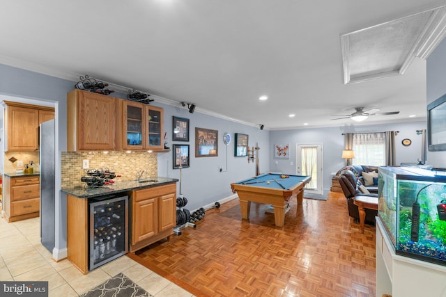 recreation room featuring recessed lighting, a sink, wine cooler, pool table, and ornamental molding