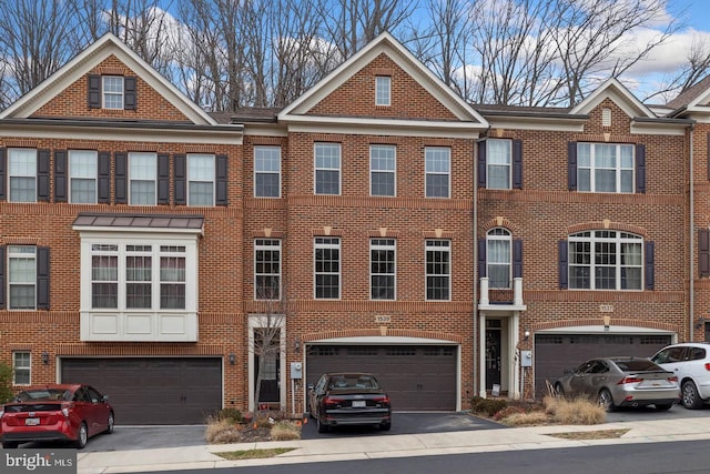 1539 Rabbit Hollow Pl, Silver Spring, MD 20906 - view of property featuring an attached garage, brick siding, and driveway