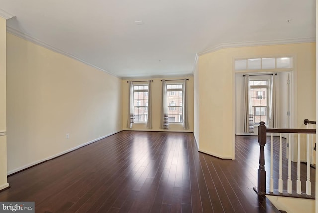 1539 Rabbit Hollow Pl, Silver Spring, MD 20906 - unfurnished living room featuring plenty of natural light, ornamental molding, baseboards, and dark wood-type flooring