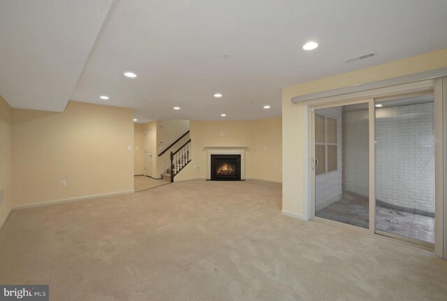 1539 Rabbit Hollow Pl, Silver Spring, MD 20906 - below grade area with light colored carpet, stairs, recessed lighting, baseboards, and a fireplace with flush hearth