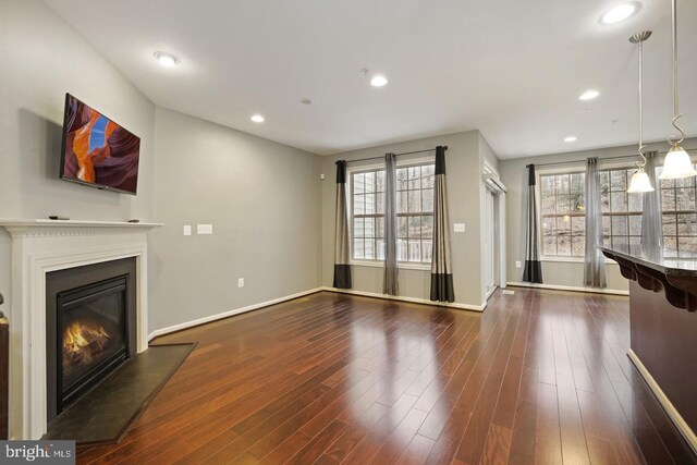 1539 Rabbit Hollow Pl, Silver Spring, MD 20906 - unfurnished living room featuring a glass covered fireplace, dark wood finished floors, baseboards, and recessed lighting