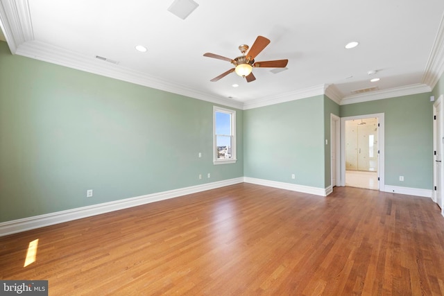 spare room featuring wood finished floors, visible vents, and recessed lighting