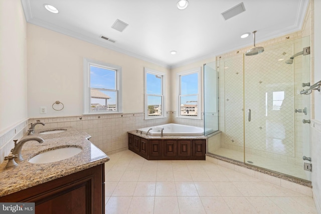 full bathroom featuring crown molding and a sink
