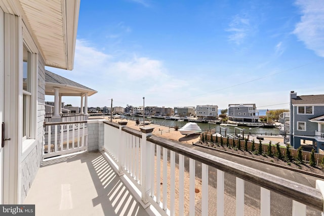 balcony featuring a water view