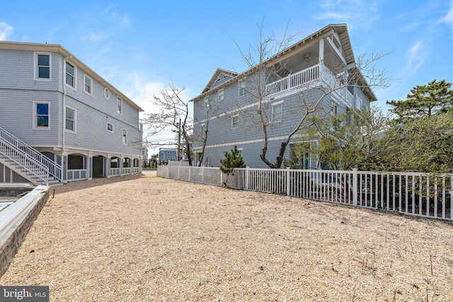 exterior space featuring fence and a balcony