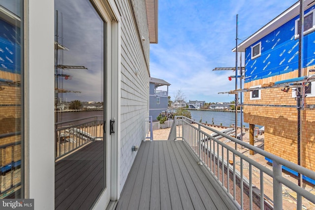 balcony featuring a water view