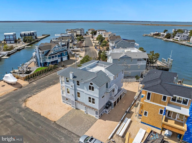 aerial view with a residential view and a water view