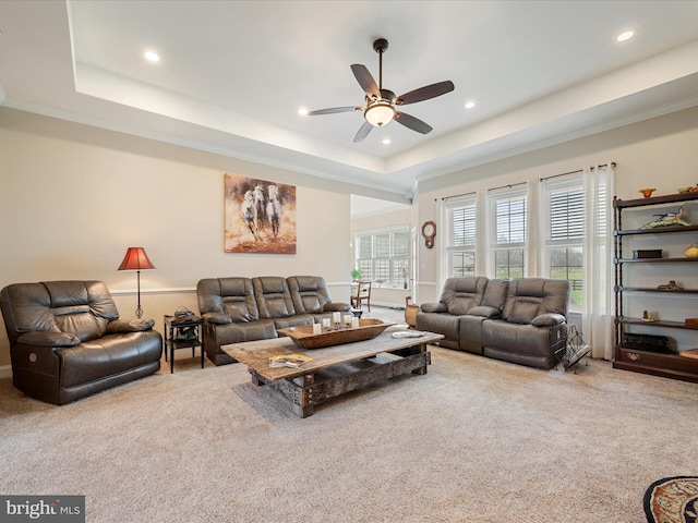 living area with recessed lighting, a ceiling fan, carpet flooring, and a raised ceiling