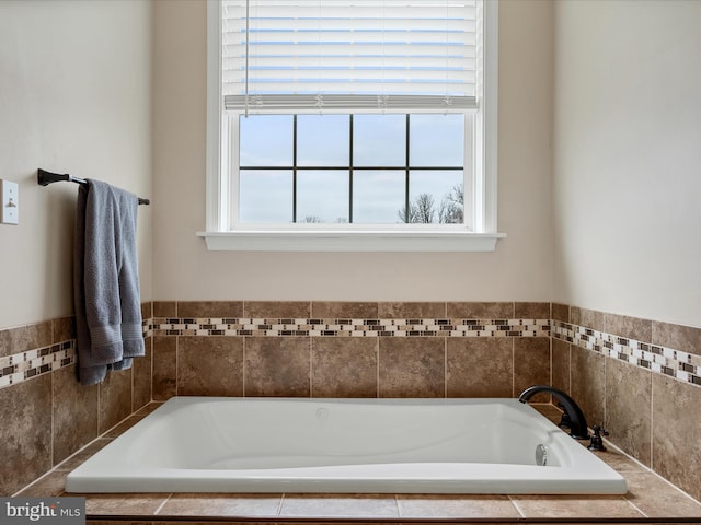 bathroom with a garden tub