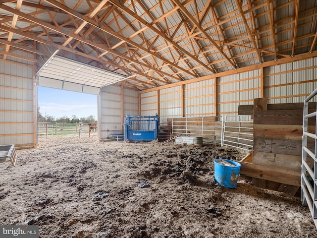 view of horse barn featuring a rural view
