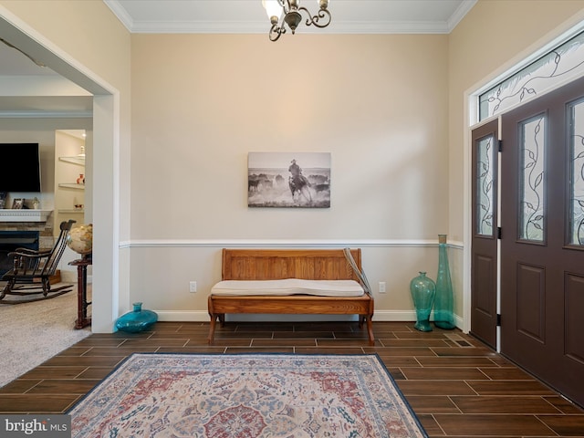 entryway with baseboards, wood tiled floor, and ornamental molding
