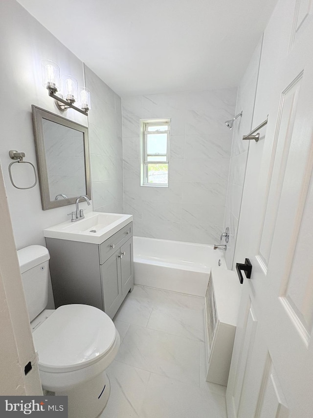 bathroom featuring marble finish floor, vanity,  shower combination, and toilet