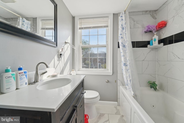 full bathroom featuring shower / tub combo, baseboards, toilet, vanity, and marble finish floor