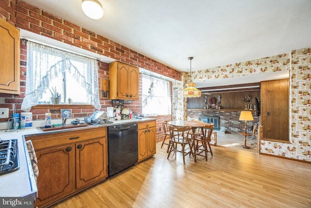 kitchen featuring dishwasher, brick wall, light wood-style flooring, light countertops, and brown cabinets