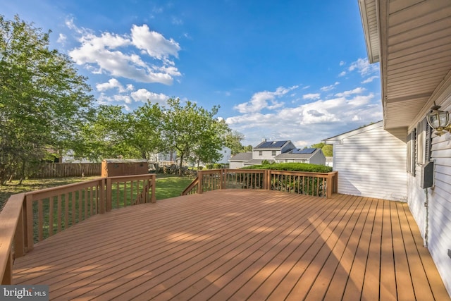 deck featuring a storage unit and an outdoor structure