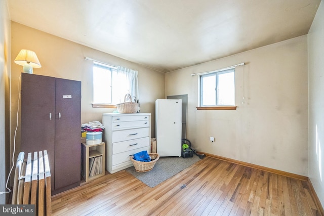 interior space with hardwood / wood-style flooring and baseboards