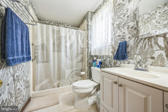 bathroom with wallpapered walls, toilet, vanity, a shower with shower curtain, and tile patterned floors