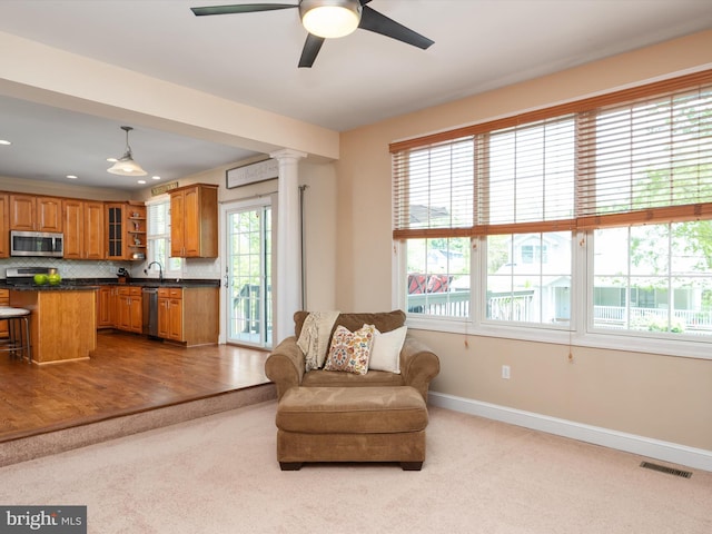 3325 Cedar Dr, Edgewater, MD 21037 - living area featuring visible vents, carpet floors, decorative columns, baseboards, and ceiling fan