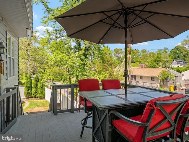 3325 Cedar Dr, Edgewater, MD 21037 - wooden terrace with outdoor dining area and fence