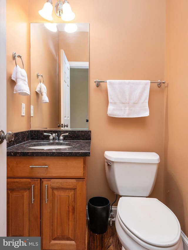 3325 Cedar Dr, Edgewater, MD 21037 - half bathroom featuring toilet, a notable chandelier, and vanity