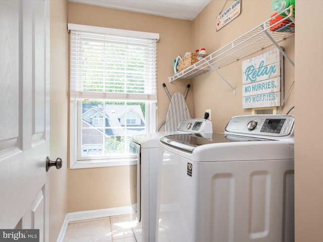 3325 Cedar Dr, Edgewater, MD 21037 - laundry area featuring laundry area, baseboards, tile patterned floors, and washing machine and clothes dryer