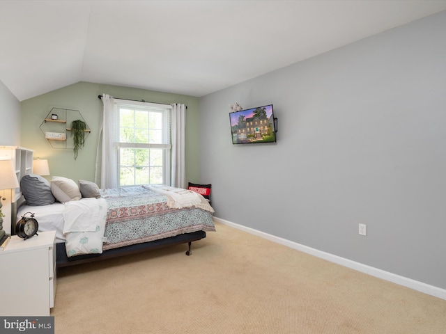 3325 Cedar Dr, Edgewater, MD 21037 - bedroom with baseboards, lofted ceiling, and light carpet