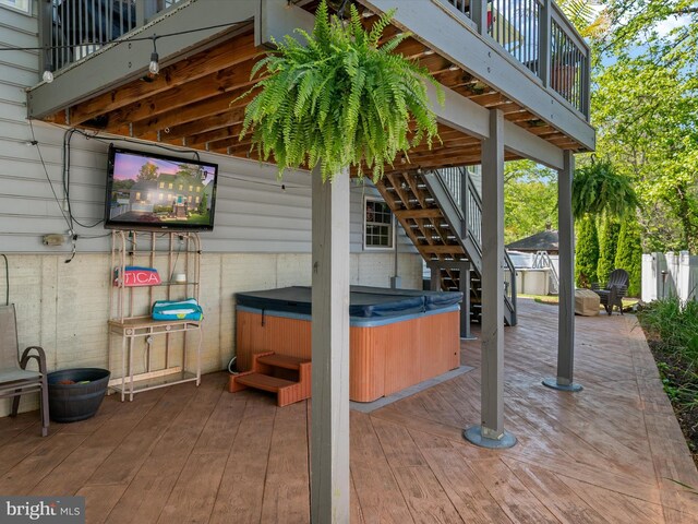 3325 Cedar Dr, Edgewater, MD 21037 - view of patio featuring stairs, a hot tub, a balcony, and a deck