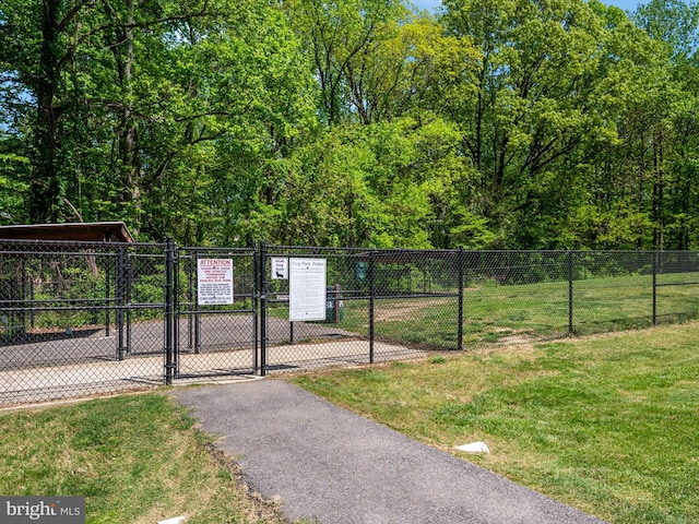 3325 Cedar Dr, Edgewater, MD 21037 - surrounding community with fence, a gate, and a yard