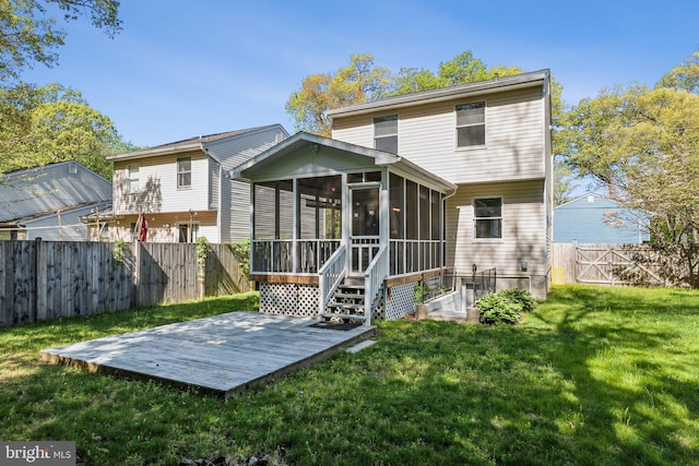 rear view of house with a yard, a deck, a fenced backyard, and a sunroom