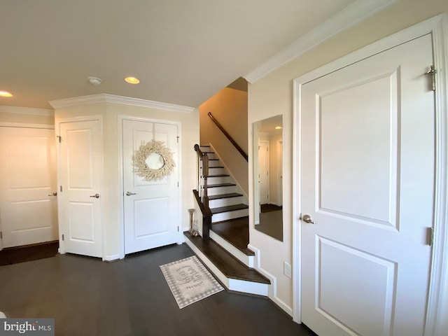 foyer featuring recessed lighting, stairs, and dark wood-style flooring