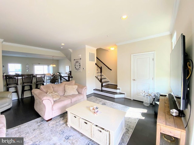 living area with stairway, crown molding, recessed lighting, and wood finished floors