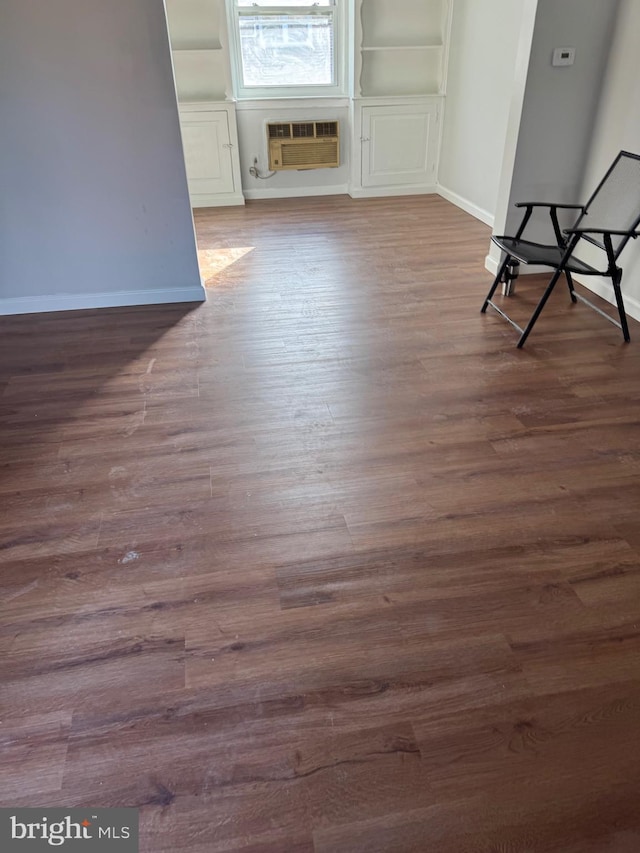 264 Margate Rd, Upper Darby, PA 19082 - spare room featuring baseboards, wood finished floors, and a wall unit AC