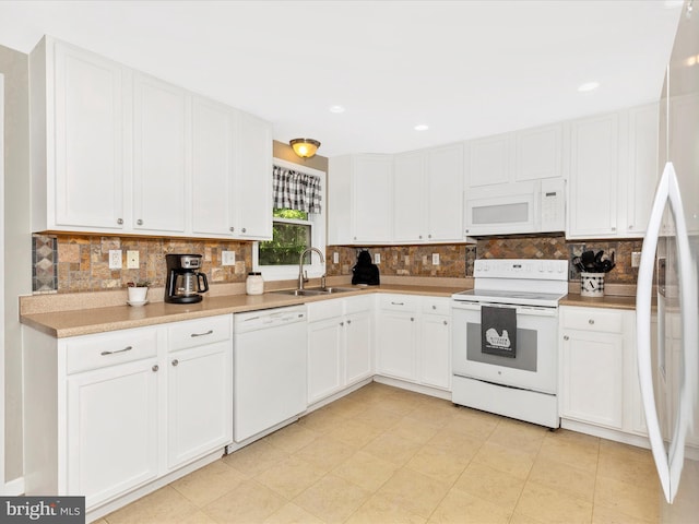 13240 Edgemont Rd, Smithsburg, MD 21783 - kitchen featuring white appliances, a sink, backsplash, and white cabinets