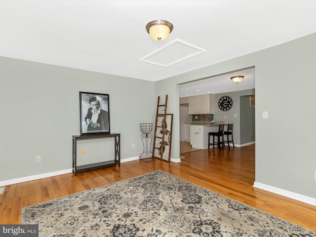 13240 Edgemont Rd, Smithsburg, MD 21783 - living area with attic access, wood finished floors, and baseboards